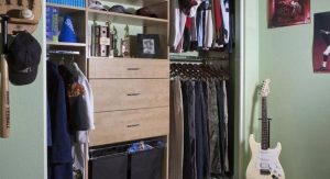 Reach-in closet in green kids' room