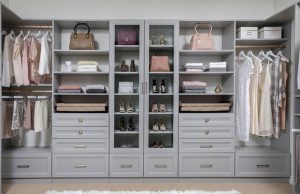 Gray closet organizer system with women's clothing