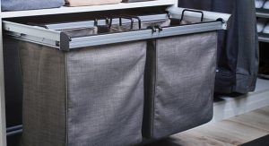 Slide-out hampers in a closet