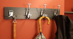 Leash, umbrella, and jacket on coat rack