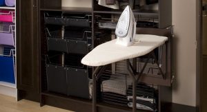 Iron and ironing board in closet