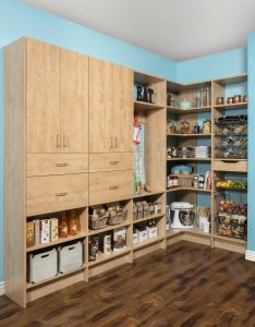 Kitchen Sammamish, WA Natural wood pantry closet organizer system in bright blue room