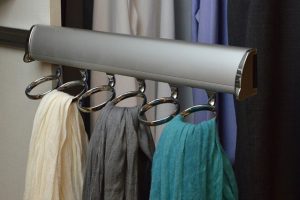 Scarves hanging from closet rack