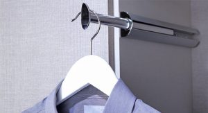 Shirt hanging on valet rod in closet