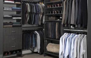 Black walk-in closet system with men's clothing